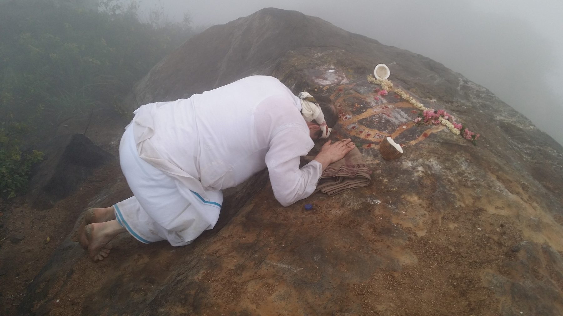 The summit puja, in mist and wind